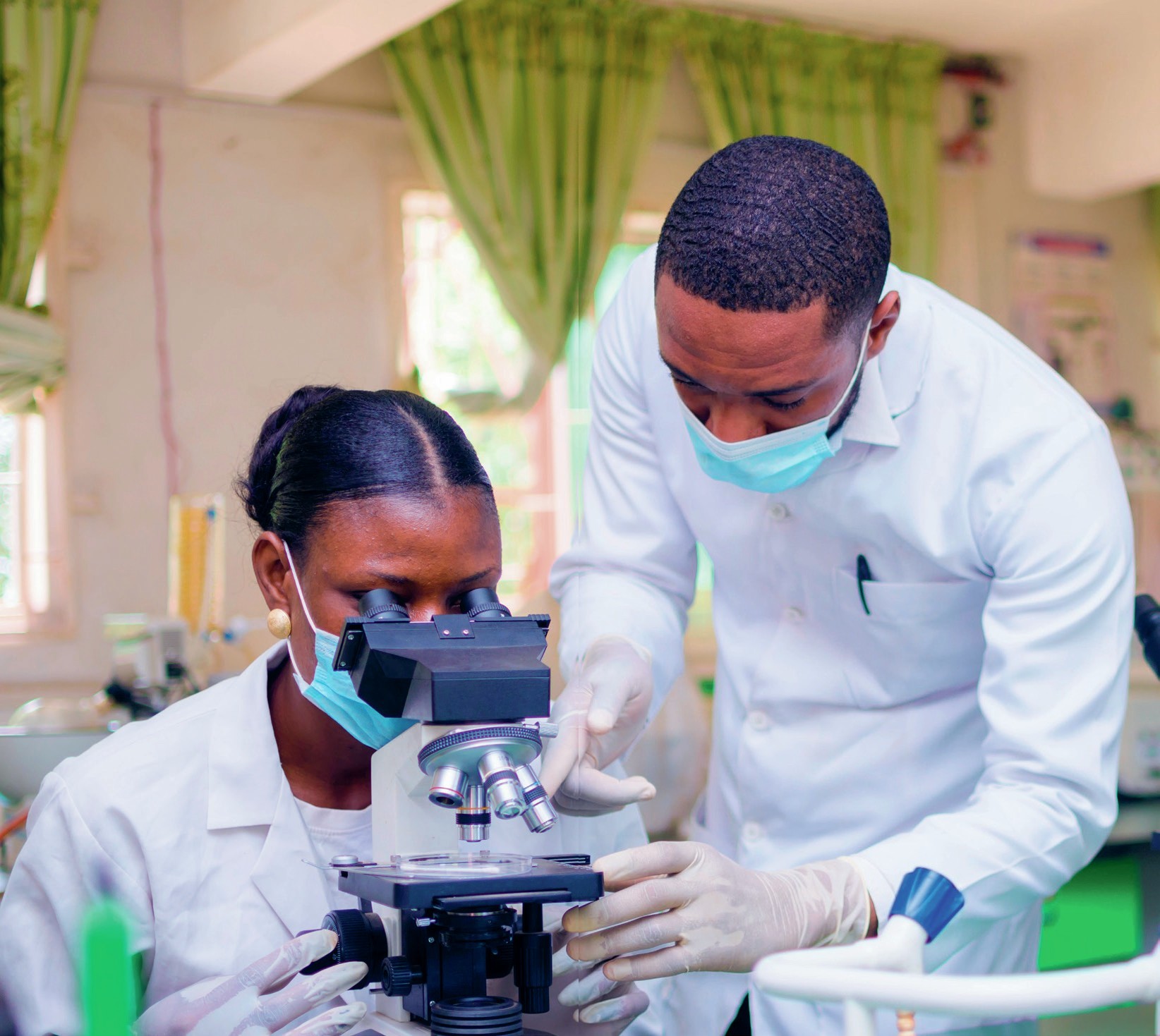 Decorative image featuring two scientists at work