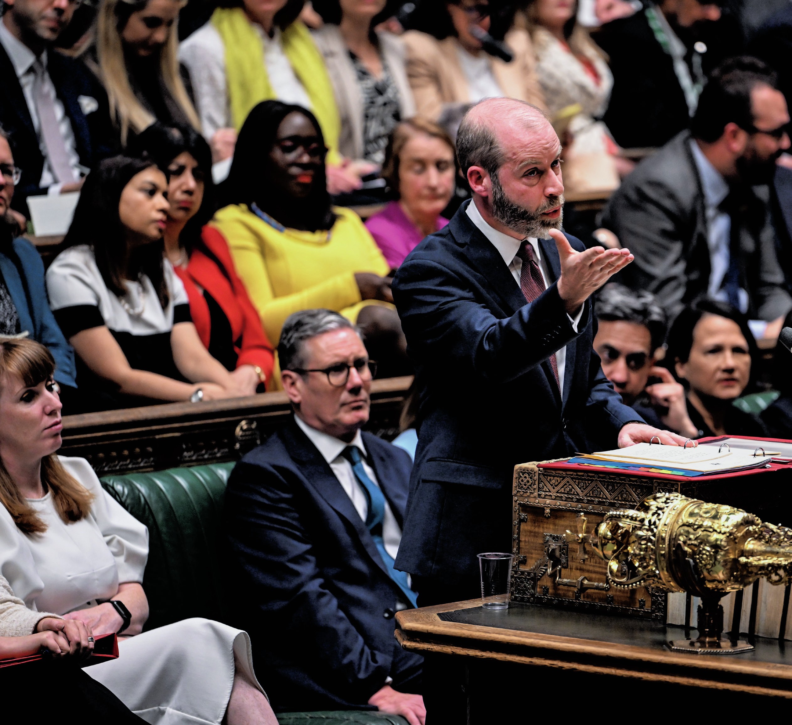 Reynolds making a speech in the House of Commons, with Labour MPs behind him, including Keir Starmer.