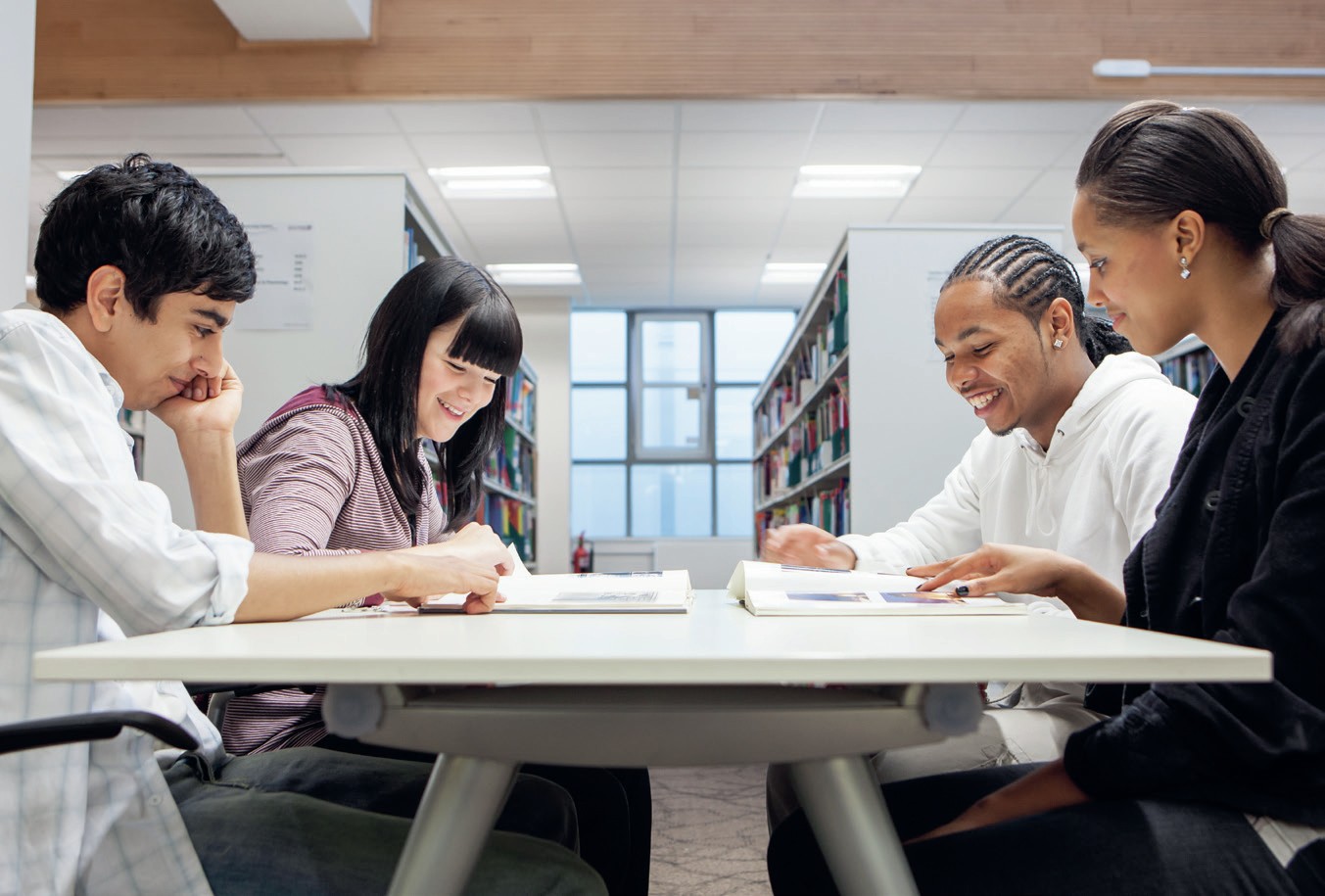 Students read together in a library.