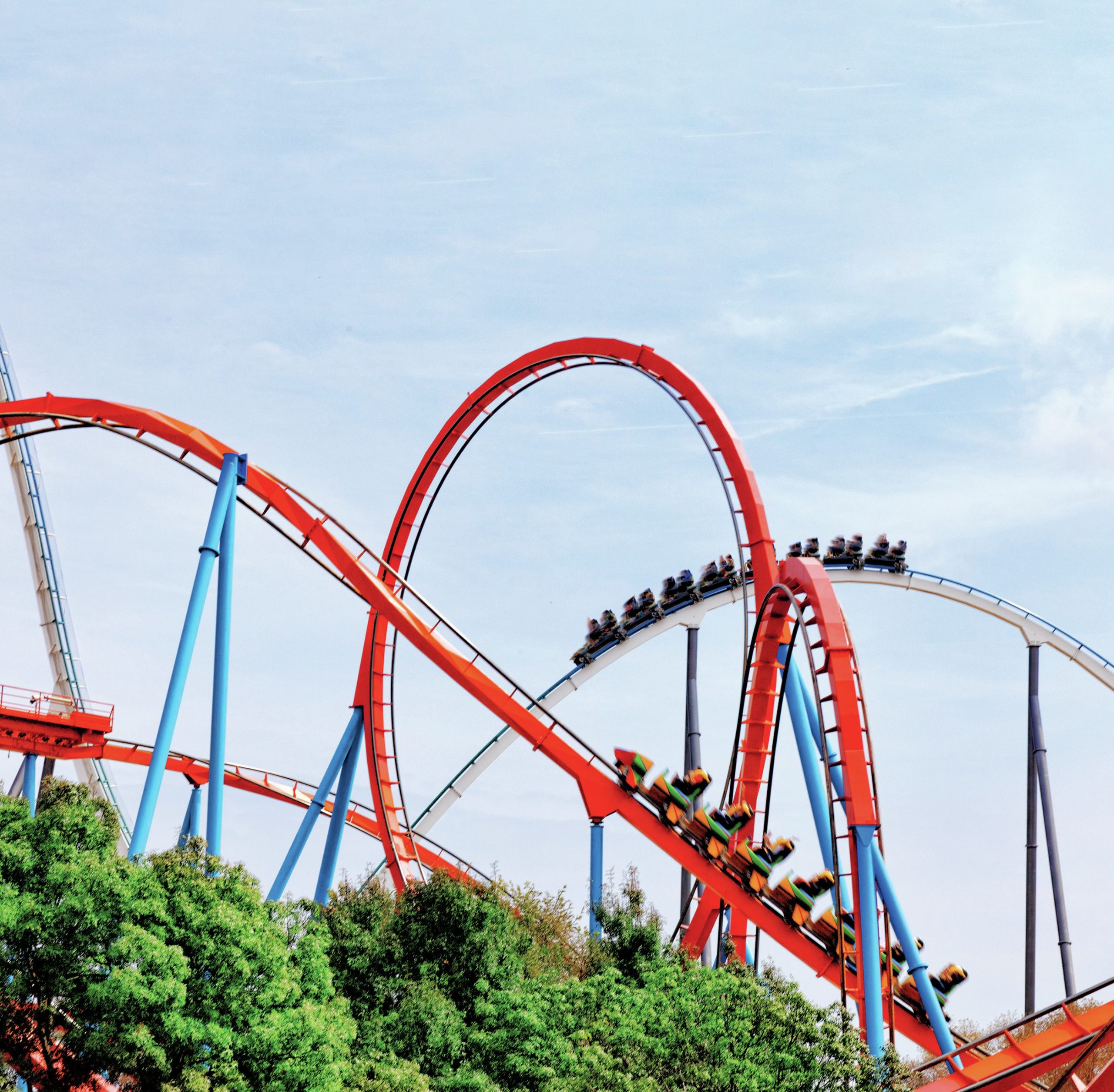 Rollercoaster with red tracks and blue supports.