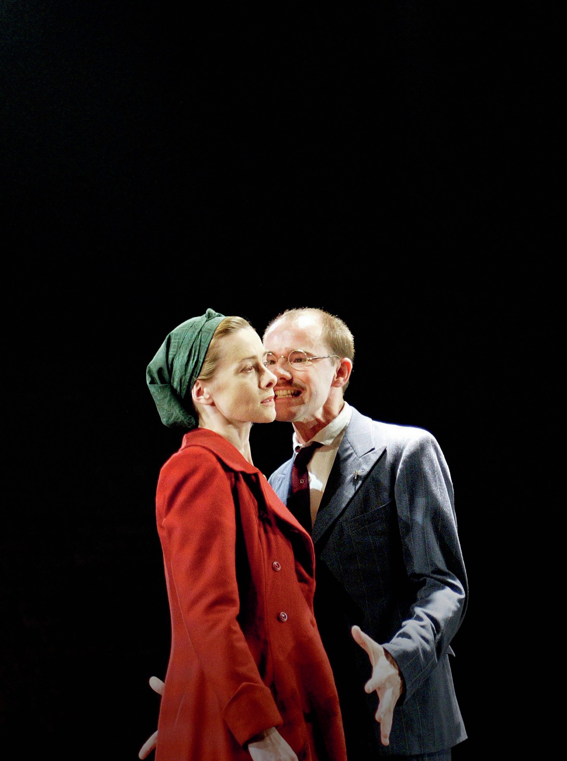 Isabella is in the foreground and Angelo is close by; it looks like he is shouting at her.