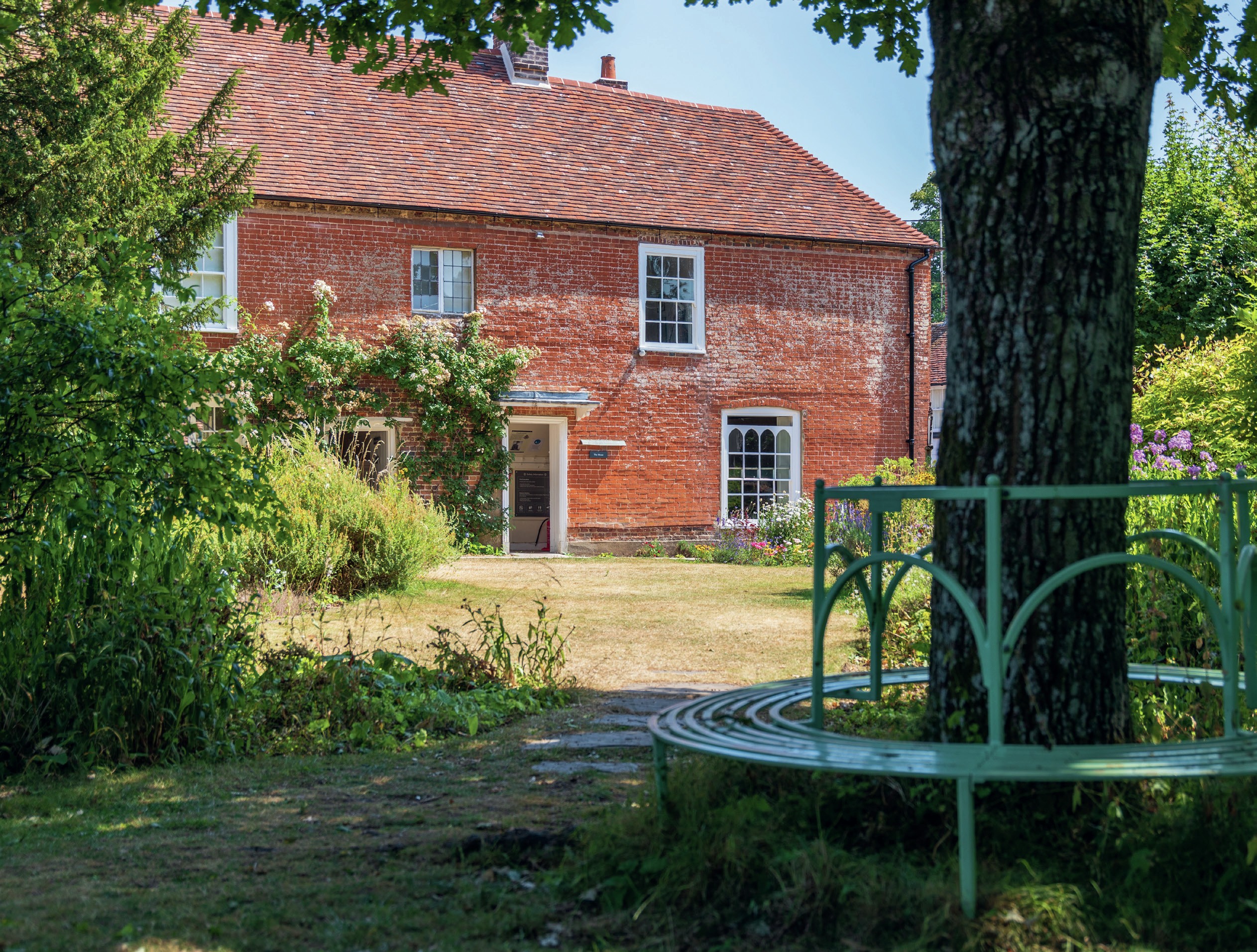 Exterior view of Chawton, a two-storey redbrick house.