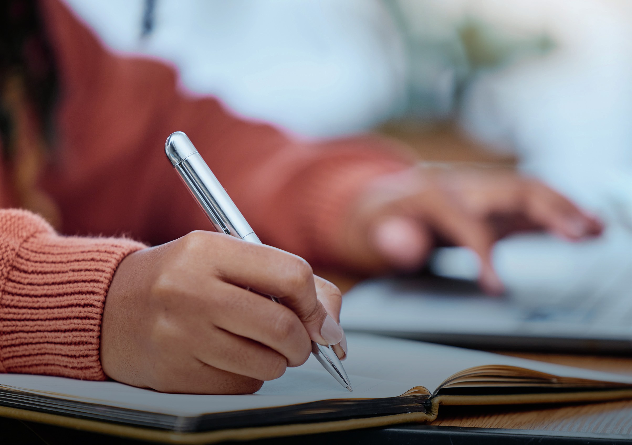 Student writing notes.