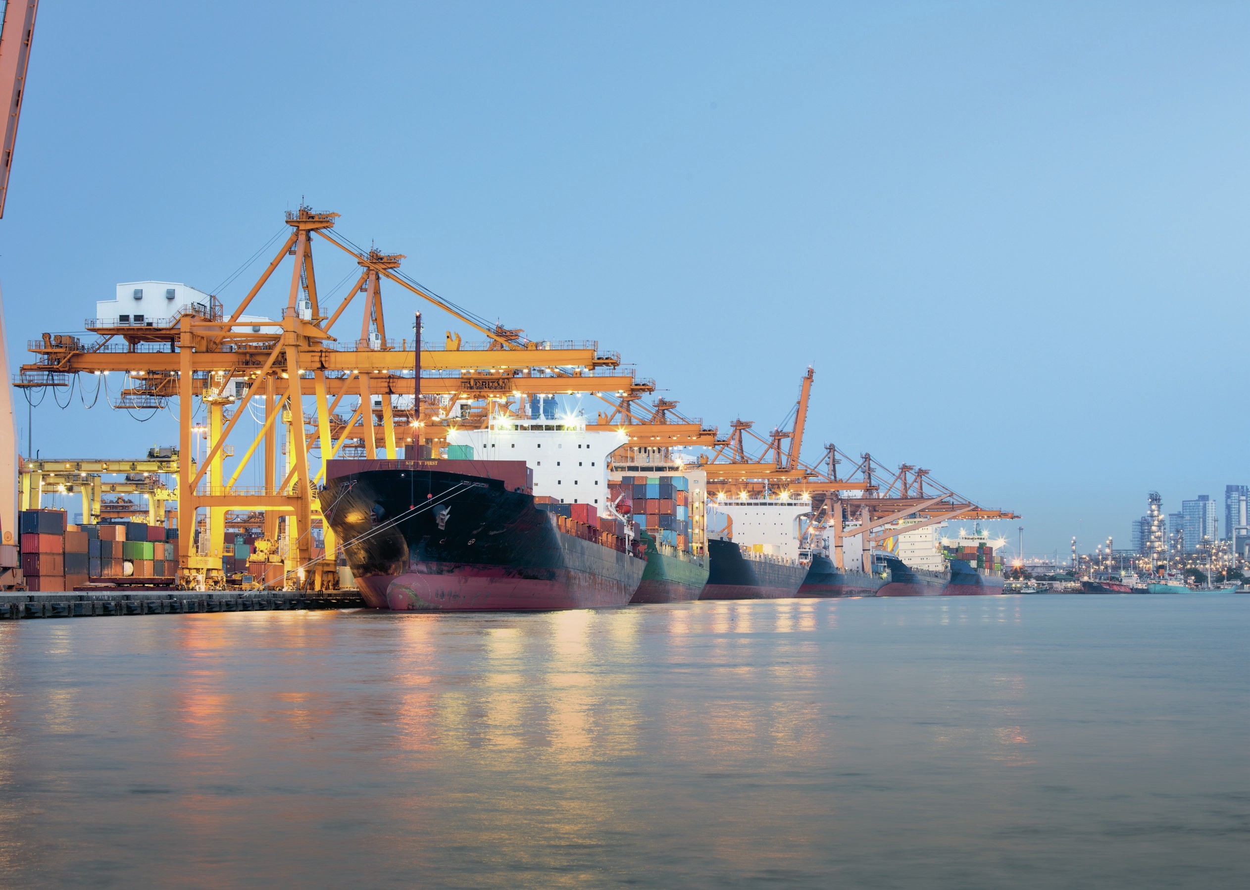 Freight vessels in a shipping dock.