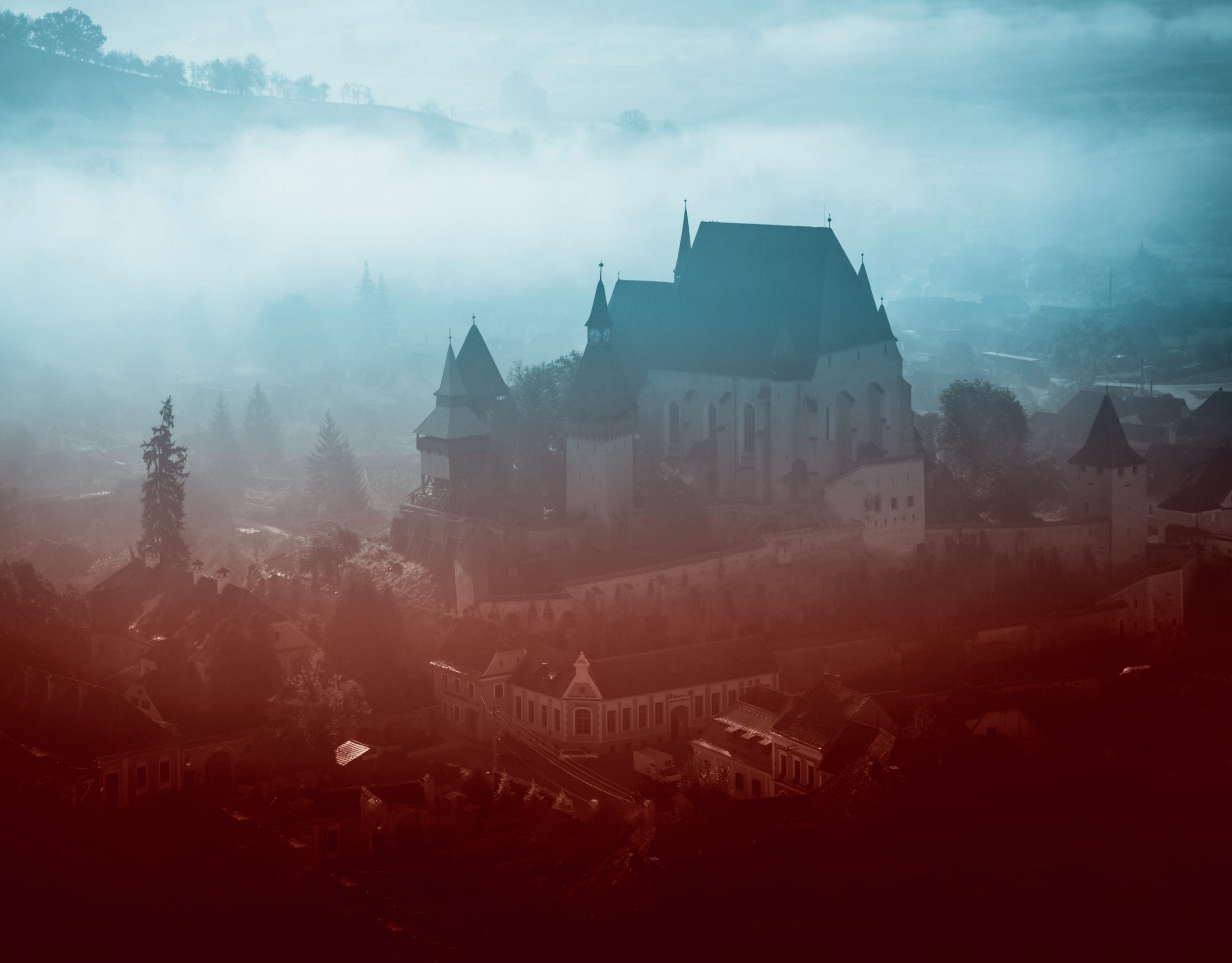 Misty aerial view of a castle in Transylvania. 