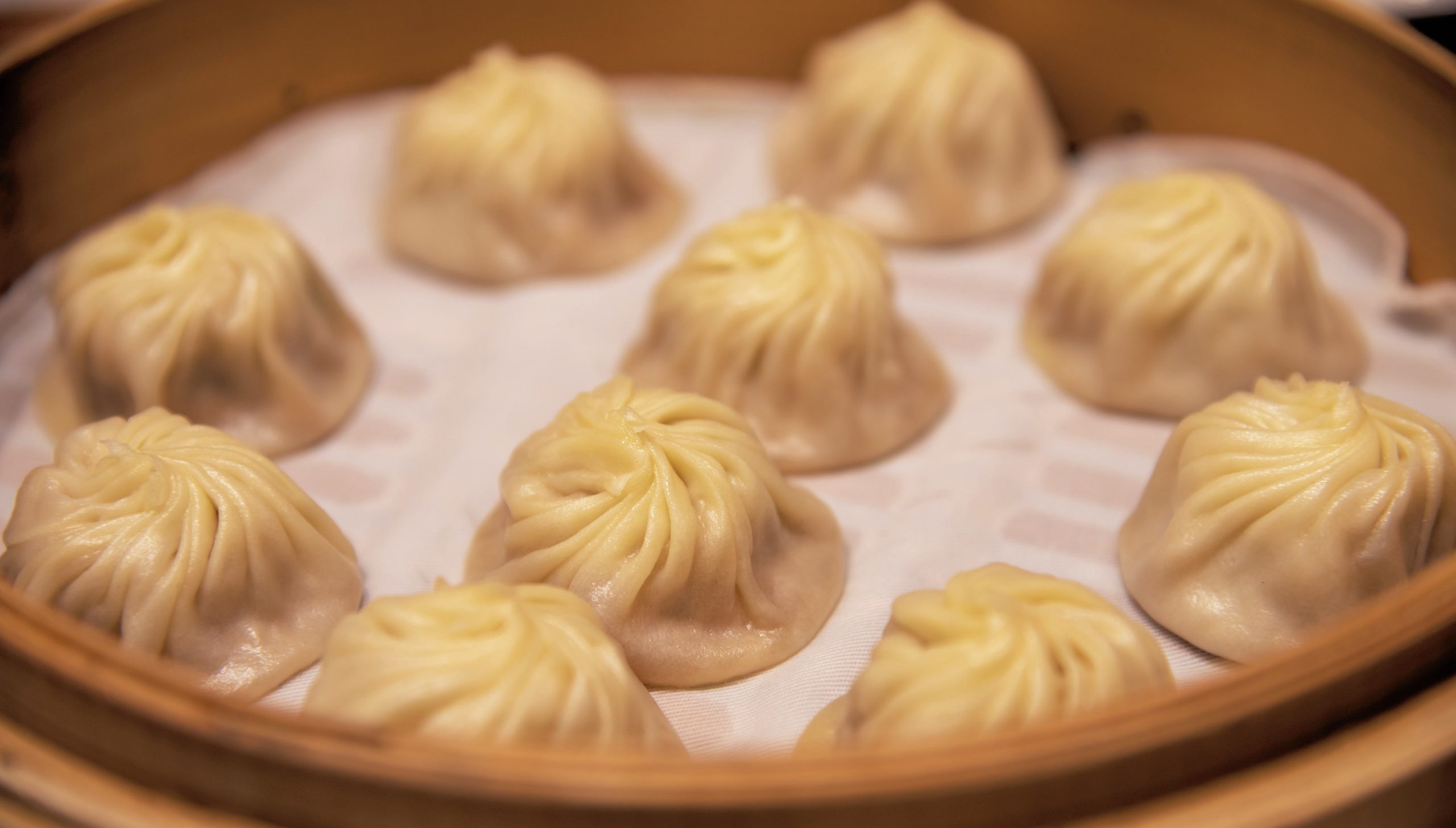 Dumplings in a steamer basket.