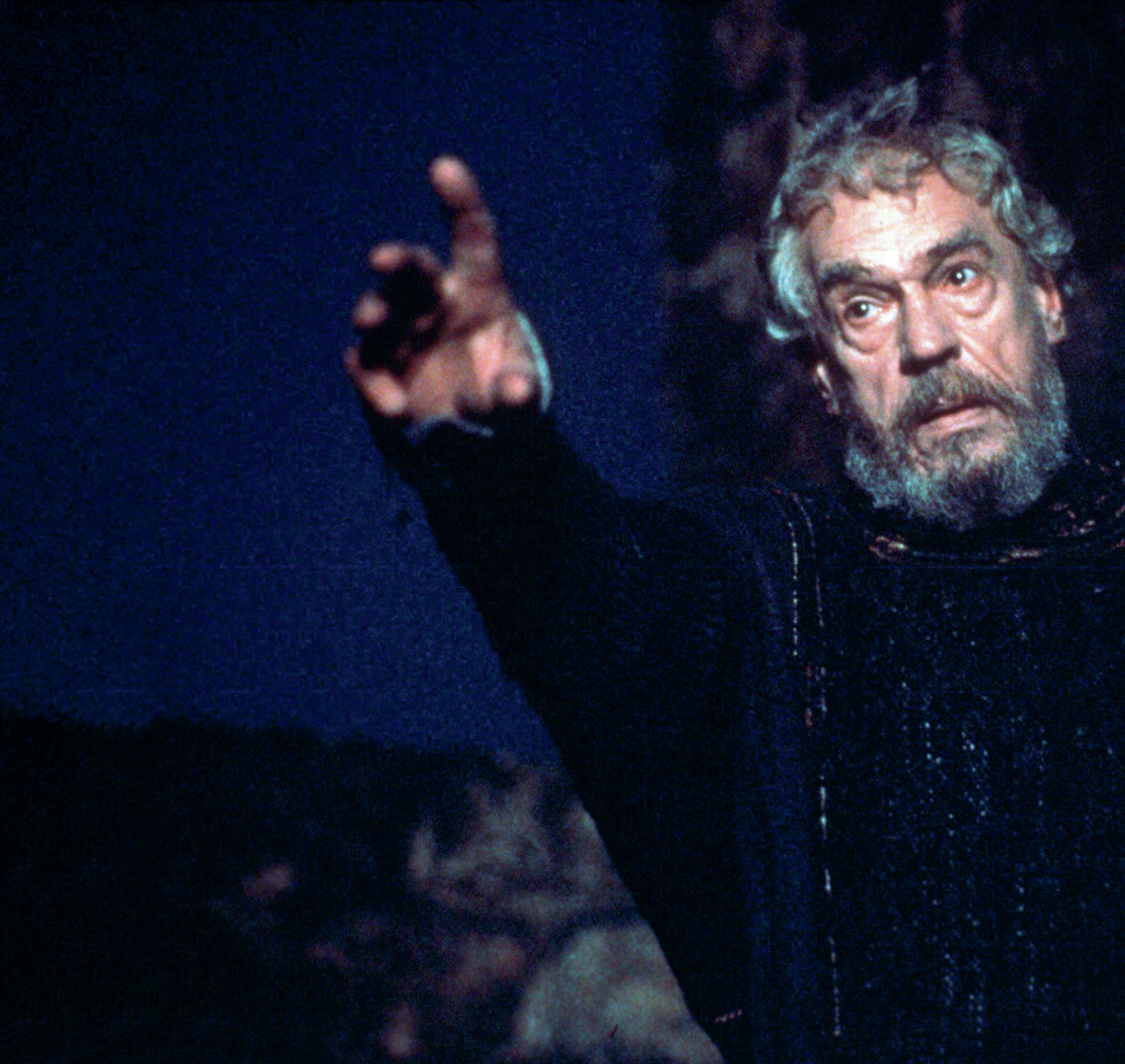 Close-up of the Ghost, who is pointing away from himself.