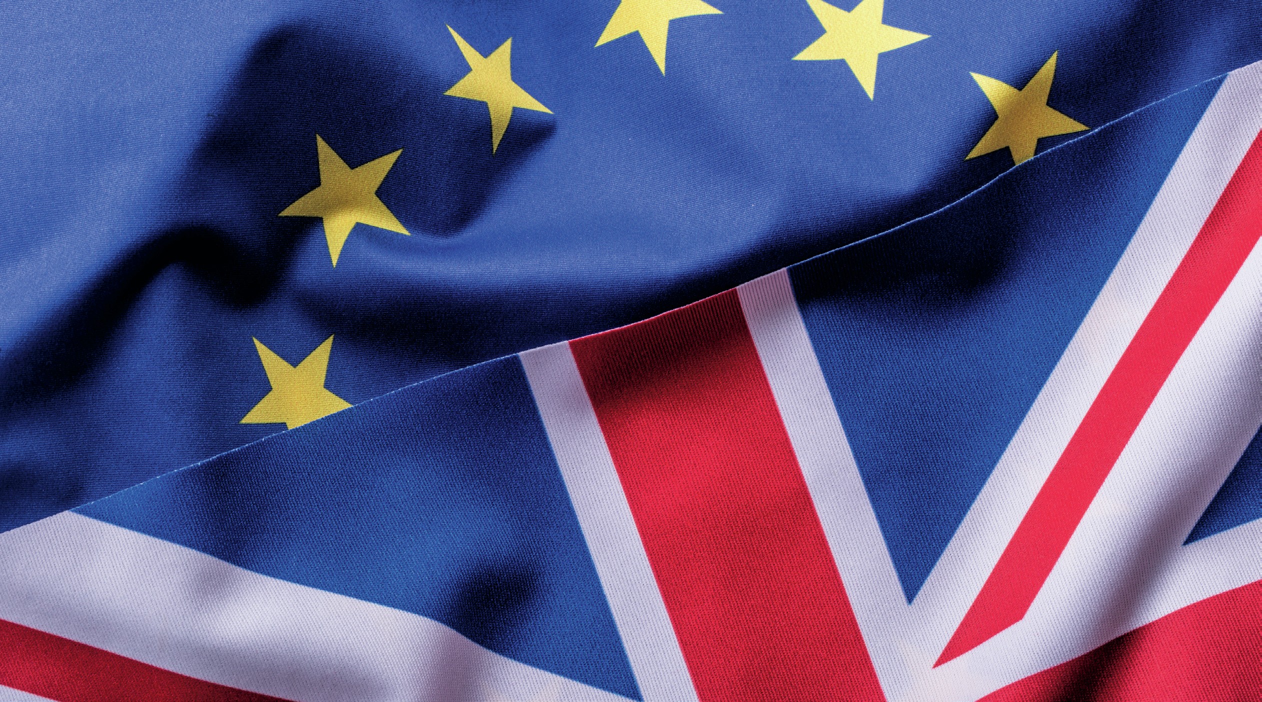 Overlapping EU and UK flags.